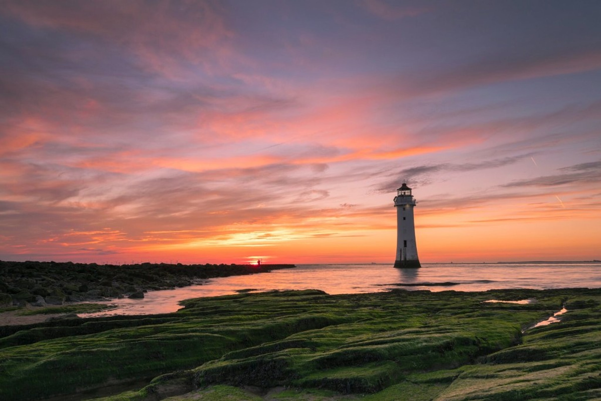 Perch Rock lighthouse at sunset — Wirral coast near holiday stays
