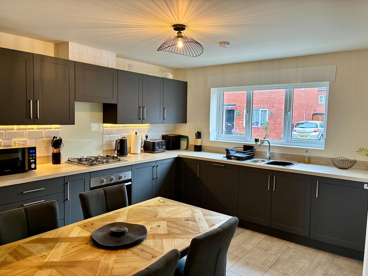 Fully equipped kitchen and dining table at Fairwater House, Birkenhead
